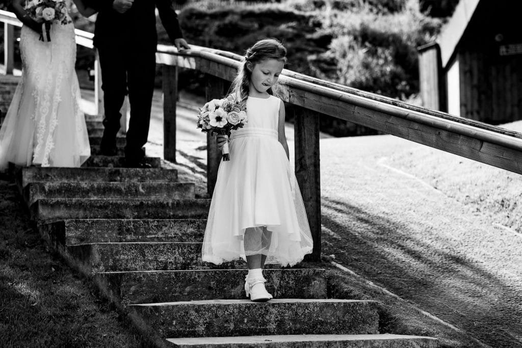 bridesmaid on steps at sandy cove