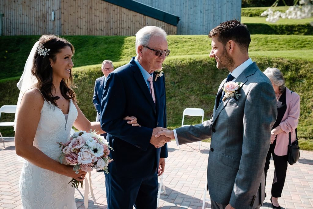 handshakes at sandy cove wedding