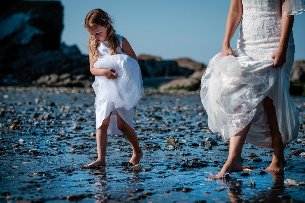 bride and bridesmaid on beach at sandy cove wedding